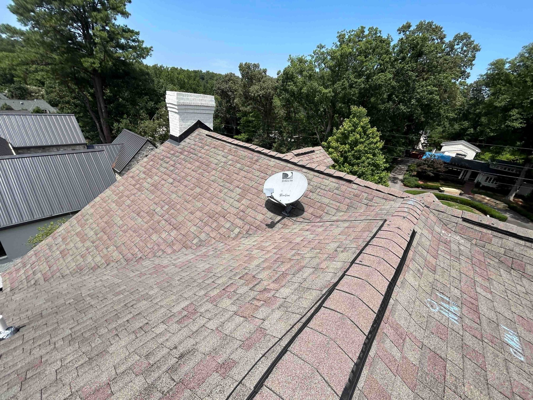 Roof Inspection by Emerald Roofing using Worn shingles with inspection test squares marked