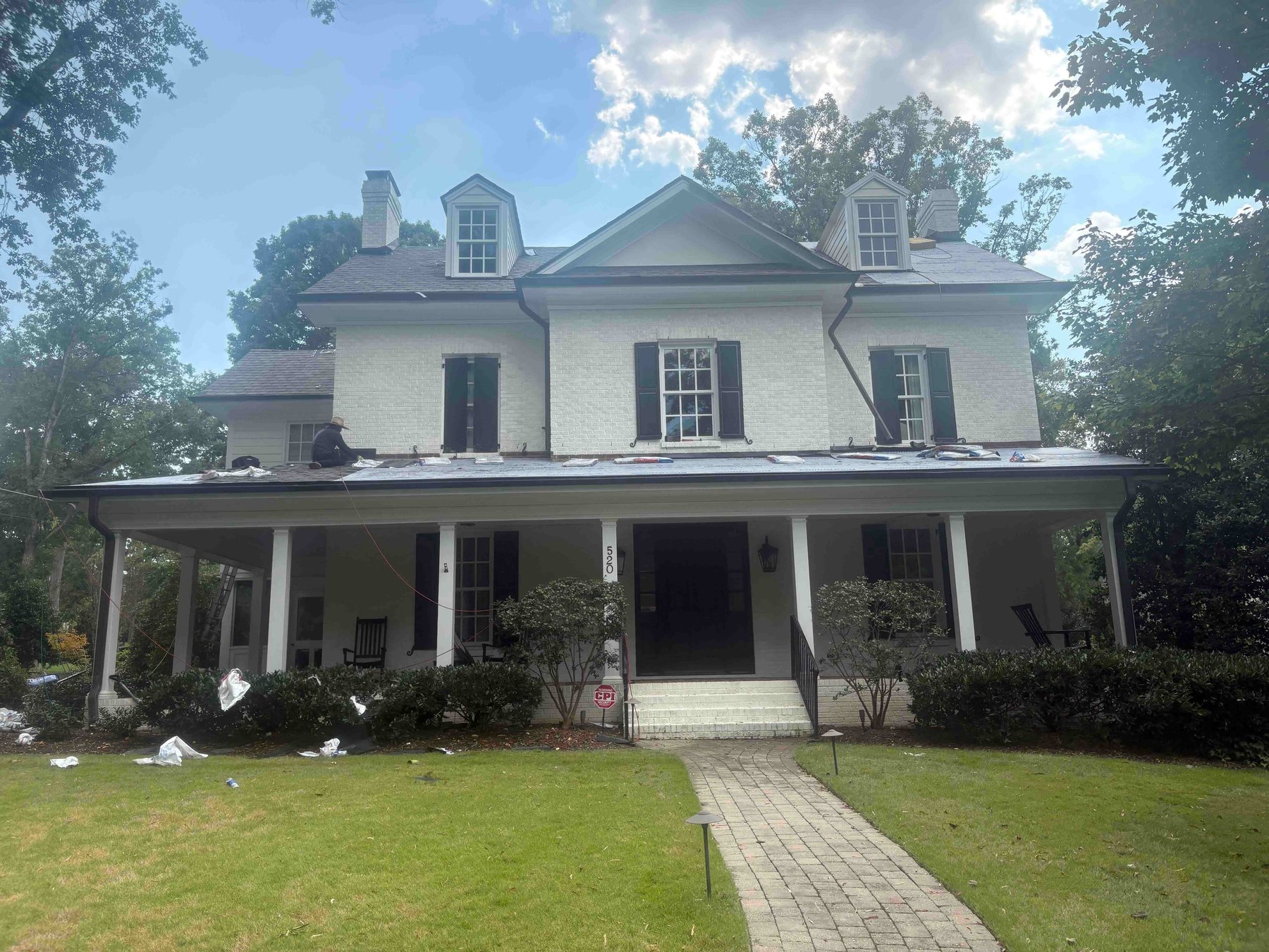 Roof Replacement by Emerald Roofing using Porch roof stripped with underlayment down