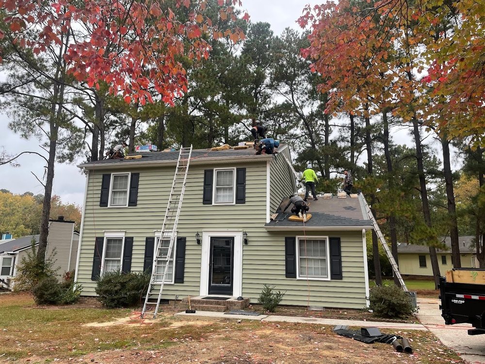 Roof Replacement by Emerald Roofing using Crew replacing a two storey roof