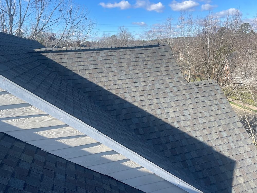 Roof Replacement by Emerald Roofing using New ridge vent and shingle detail