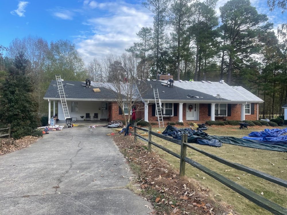 Roof Replacement by Emerald Roofing using Crew replacing a brick ranch roof