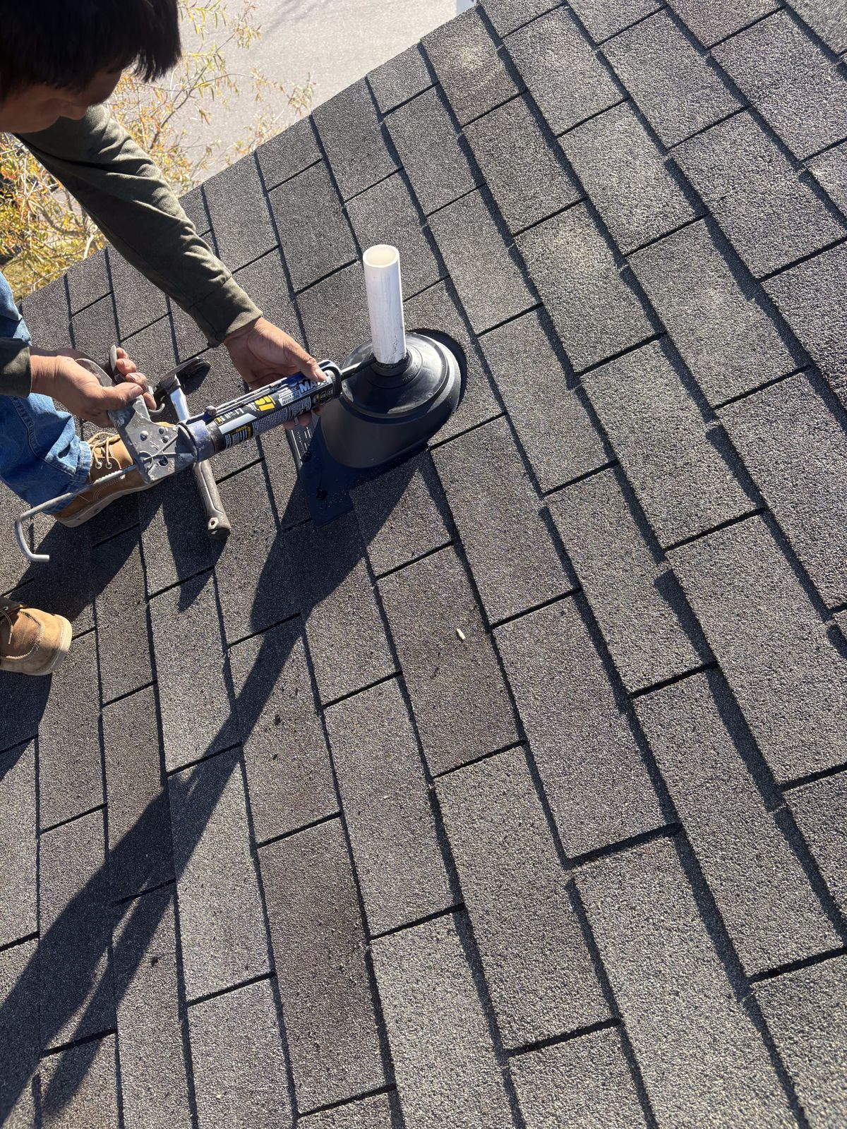 Roof Repair by Emerald Roofing using The new boot being nailed off and sealed