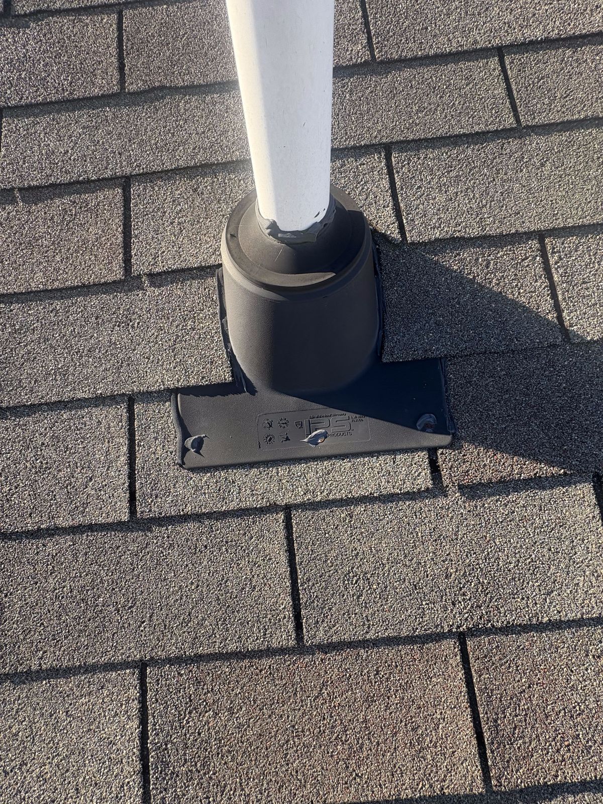 Roof Repair by Emerald Roofing using The finished pipe boot woven back into the shingle field