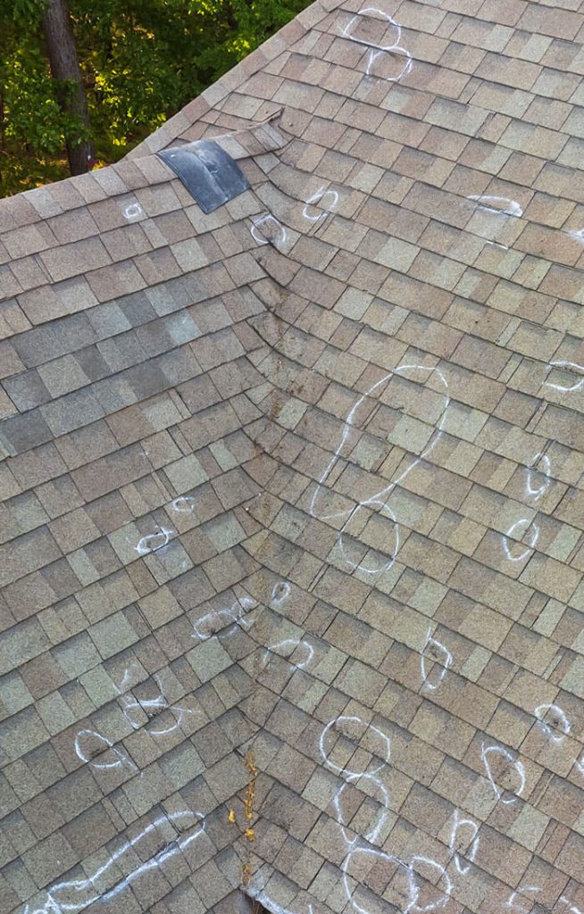 damaged shingle roof in North Carolina